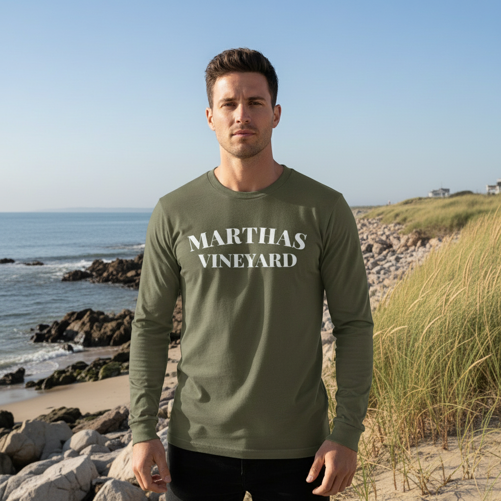 Man wearing a green 'Martha's Vineyard' shirt on a beach